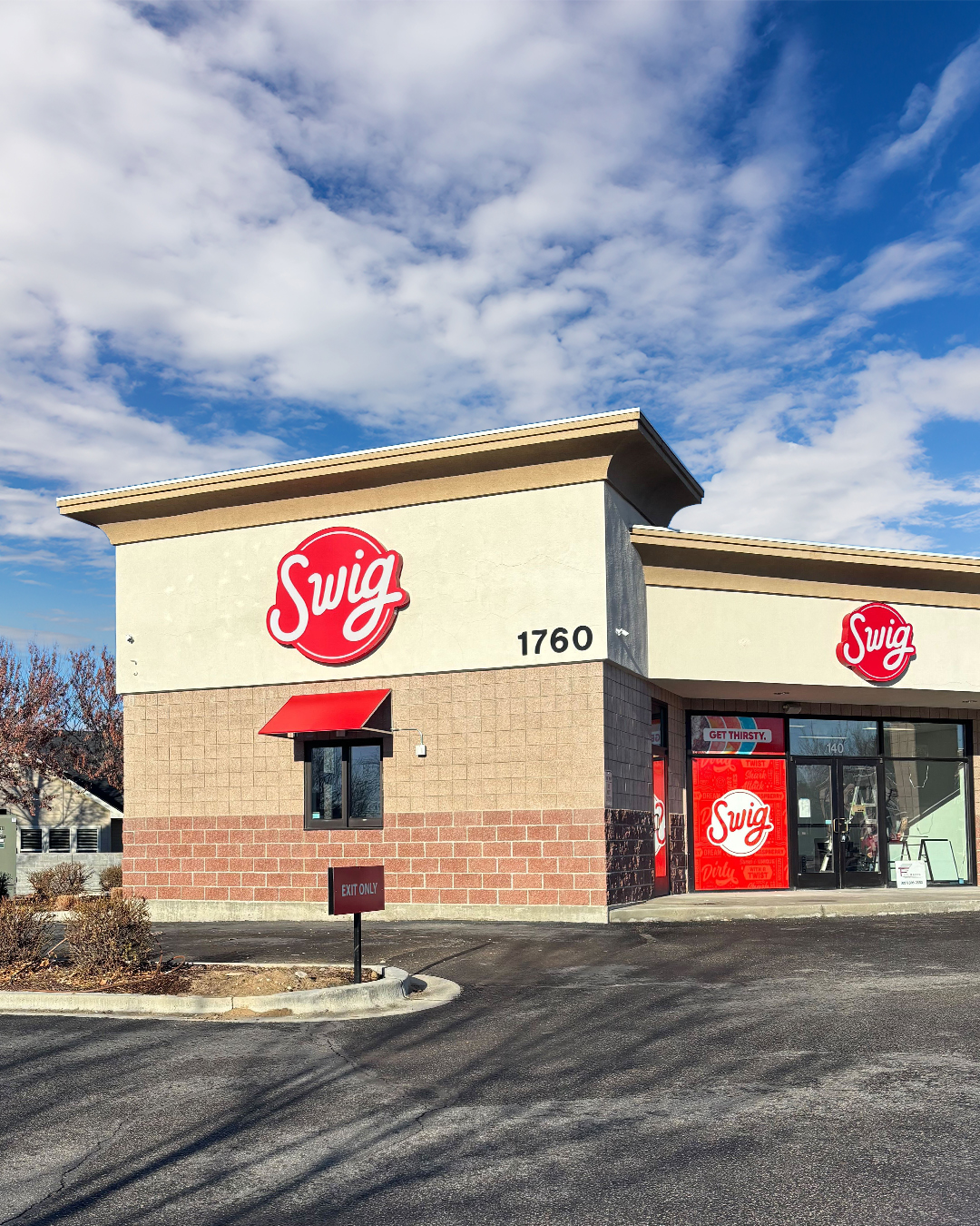 Cherry Crossing Exterior of Swig soda shop storefront in Meridian, Idaho, featuring the drive-thru window and branded signage.